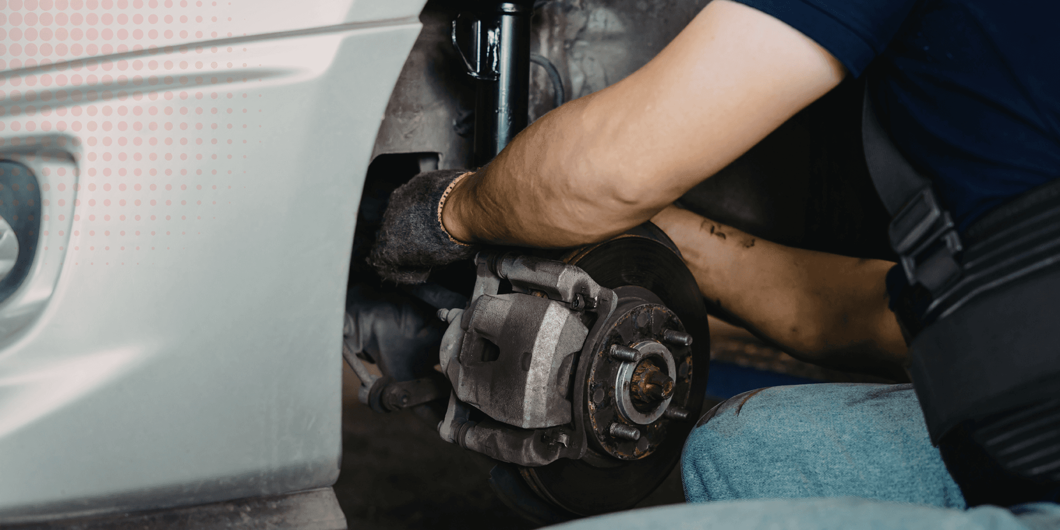 Mechanic inspecting an exhaust system